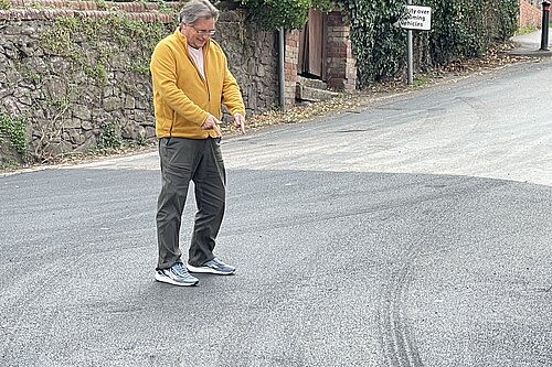 "Well done Frank." Mark Wooding inspects the resurfaced road.
